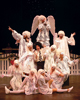 PHOTO 1: 'George' (Matt Walker) and his cast of guardian angels; Photo by Cheryl Games